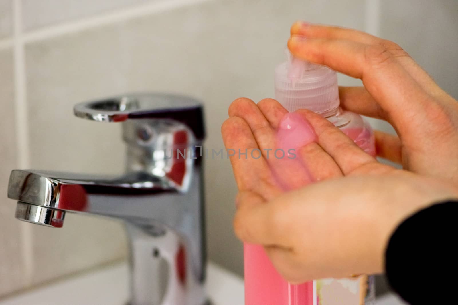 woman taking liquid soup to wash her hands