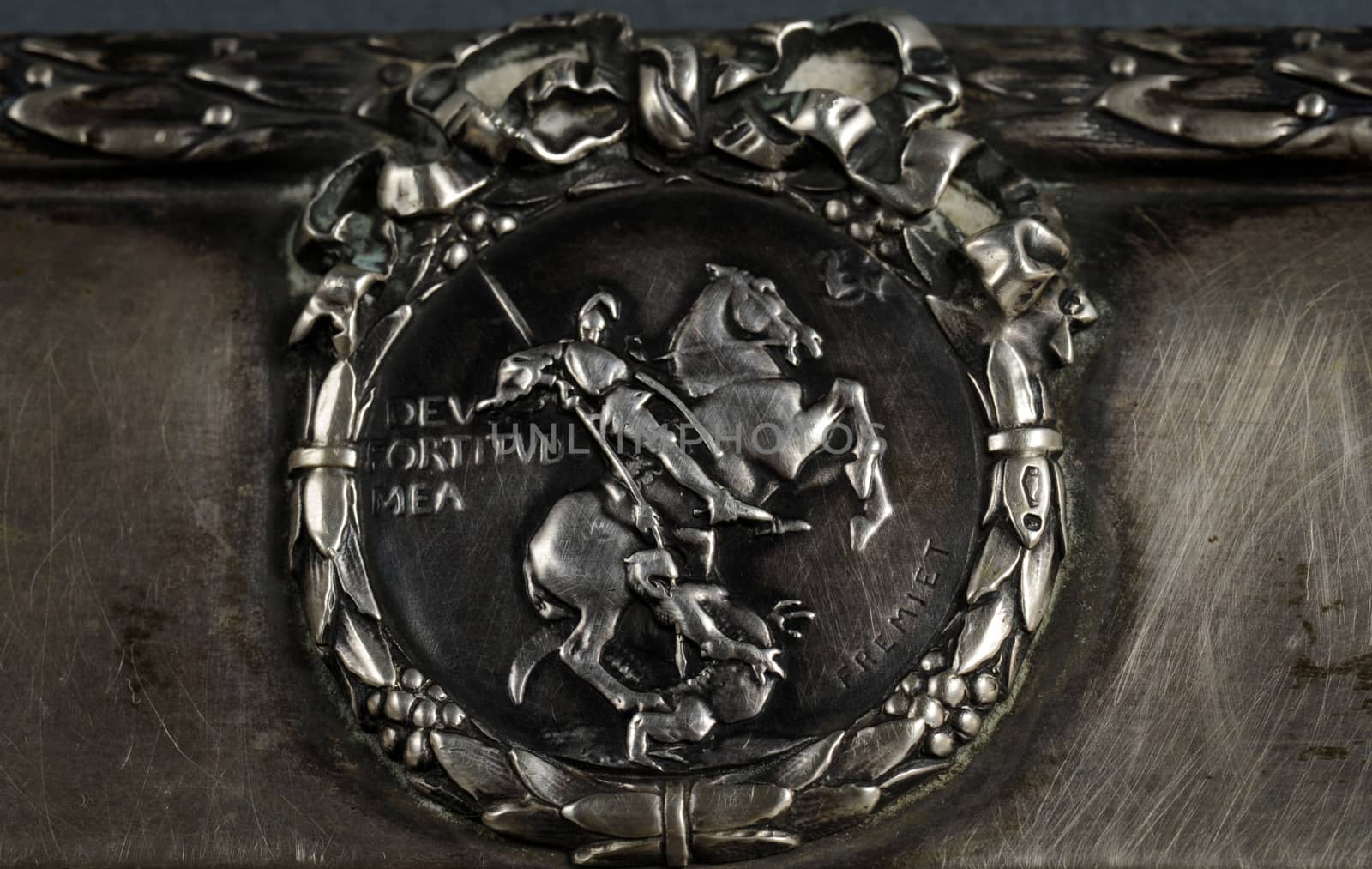 Close up view of engraved silver sign St. George slaying the dragon