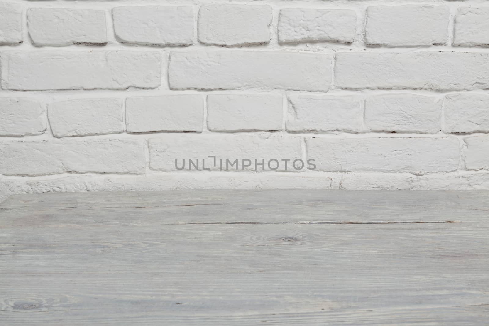 Old white brick wall and wood floor background by igor_stramyk