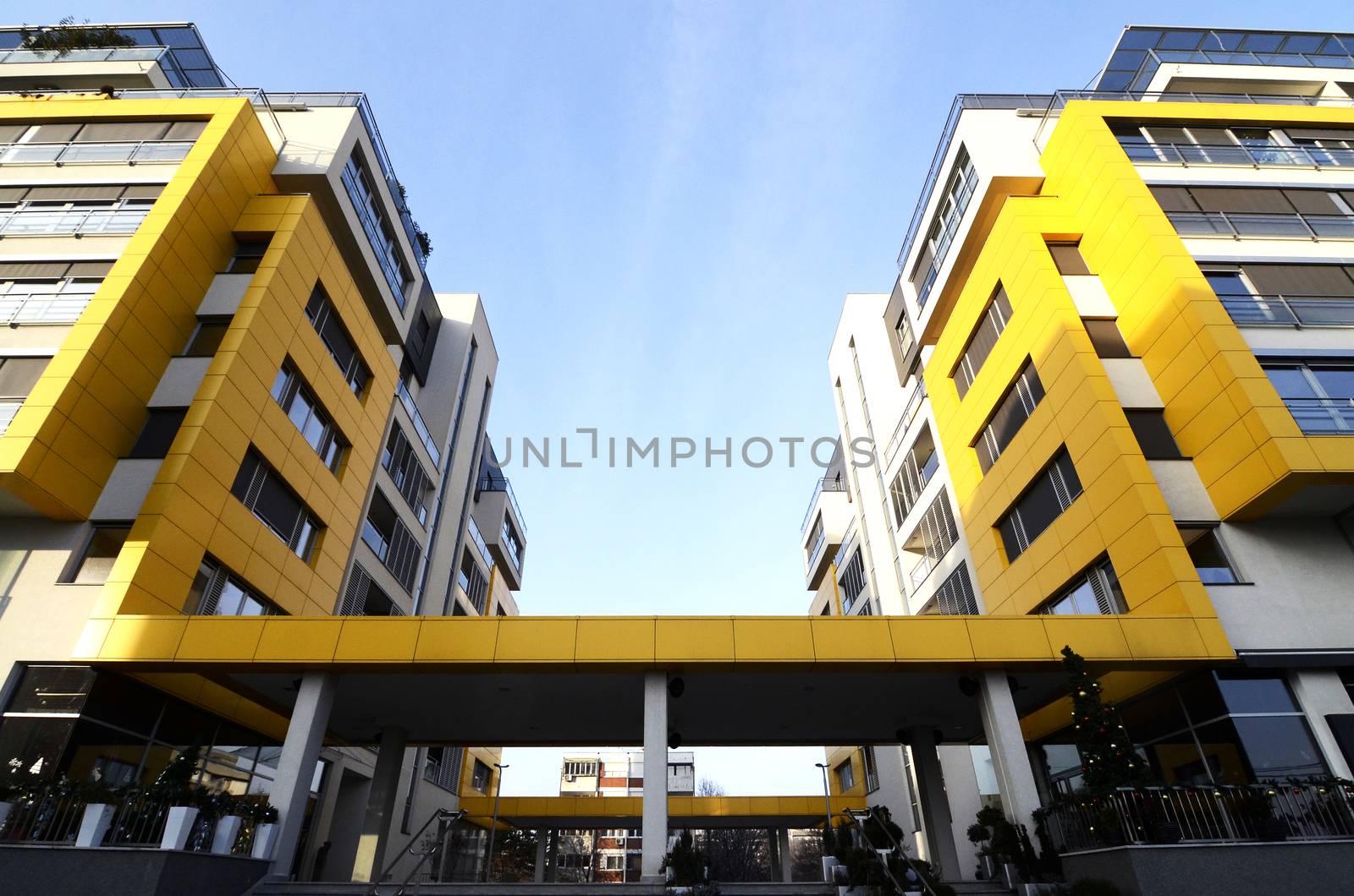 Details of a modern yellow building on sunny day