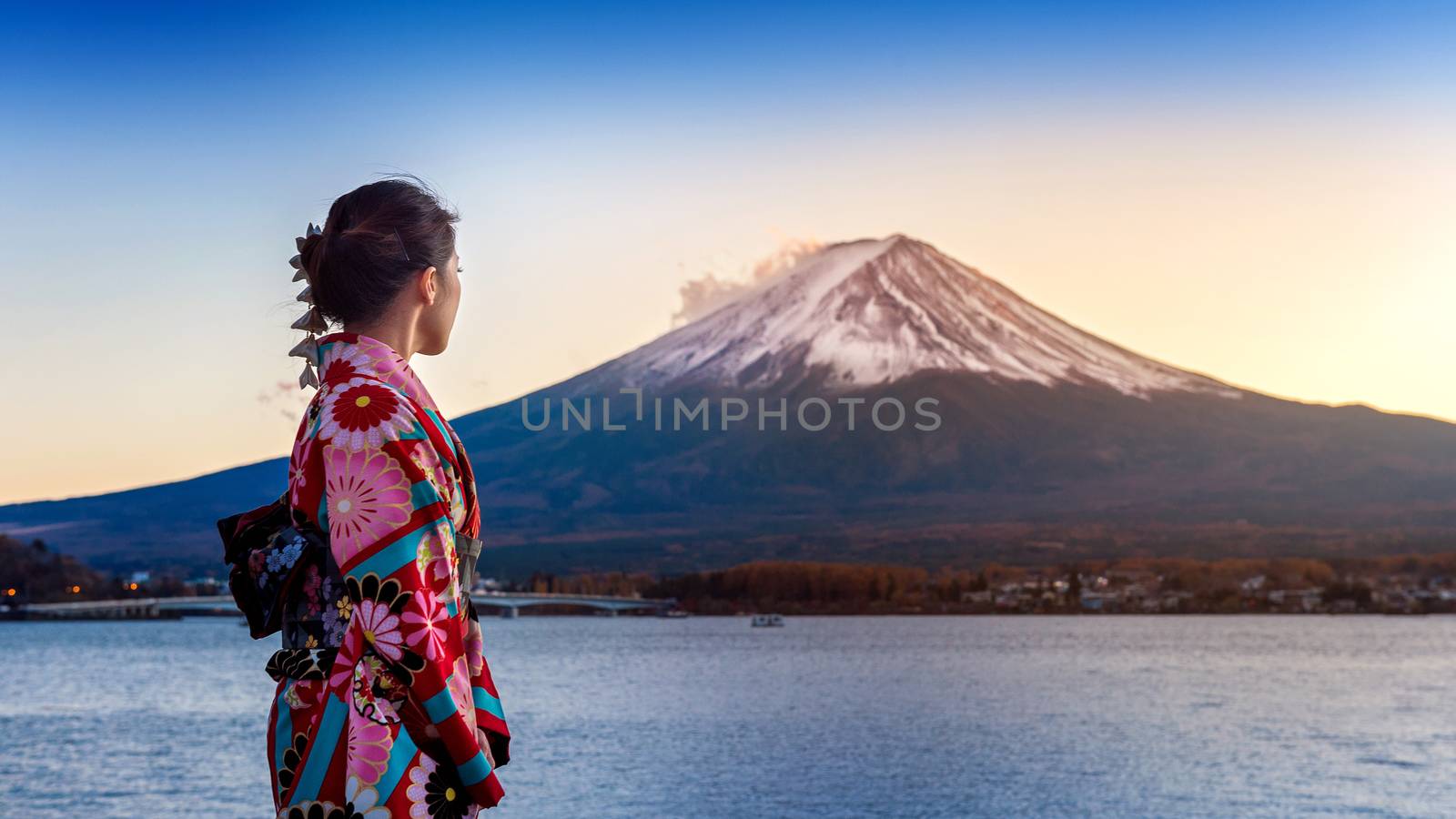 Asian woman wearing japanese traditional kimono at Fuji mountain. Sunset at Kawaguchiko lake in Japan. by gutarphotoghaphy
