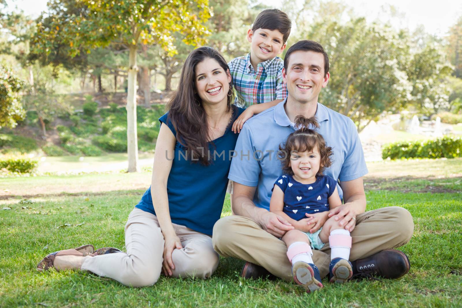Attractive Young Mixed Race Family Portrait in the Park.