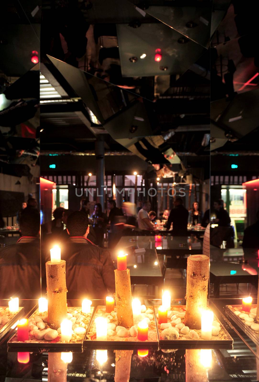 Interior of dark modern restaurant with candles