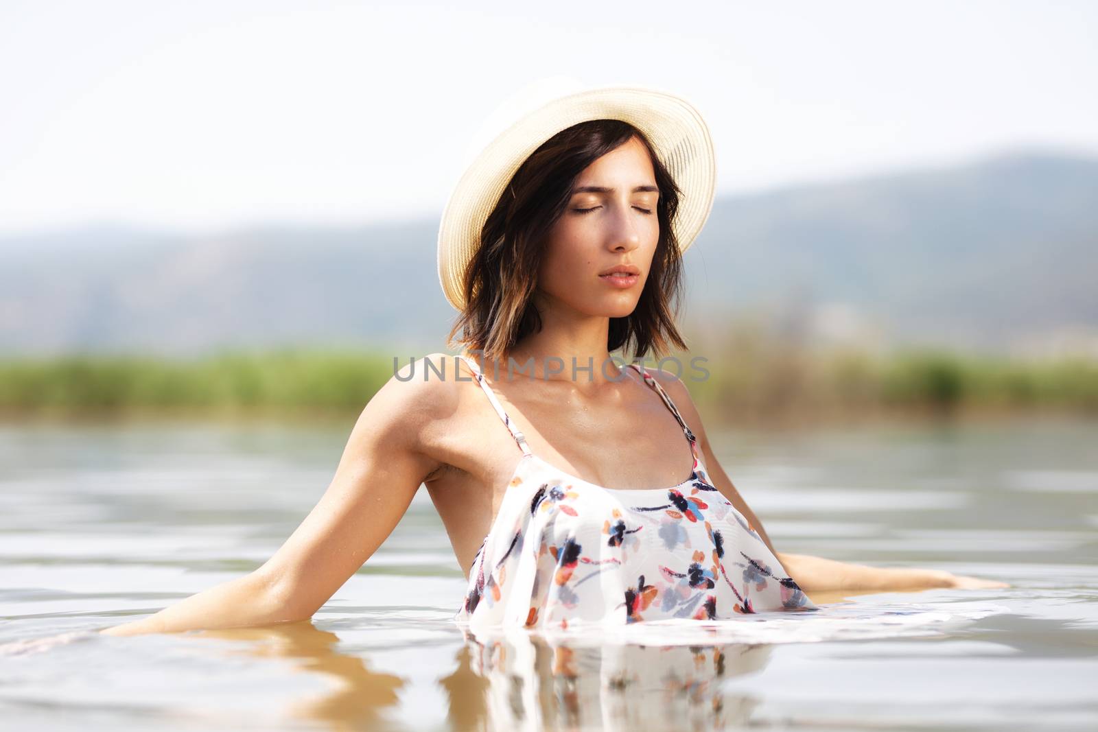 sexy girl with shirt relaxing in water