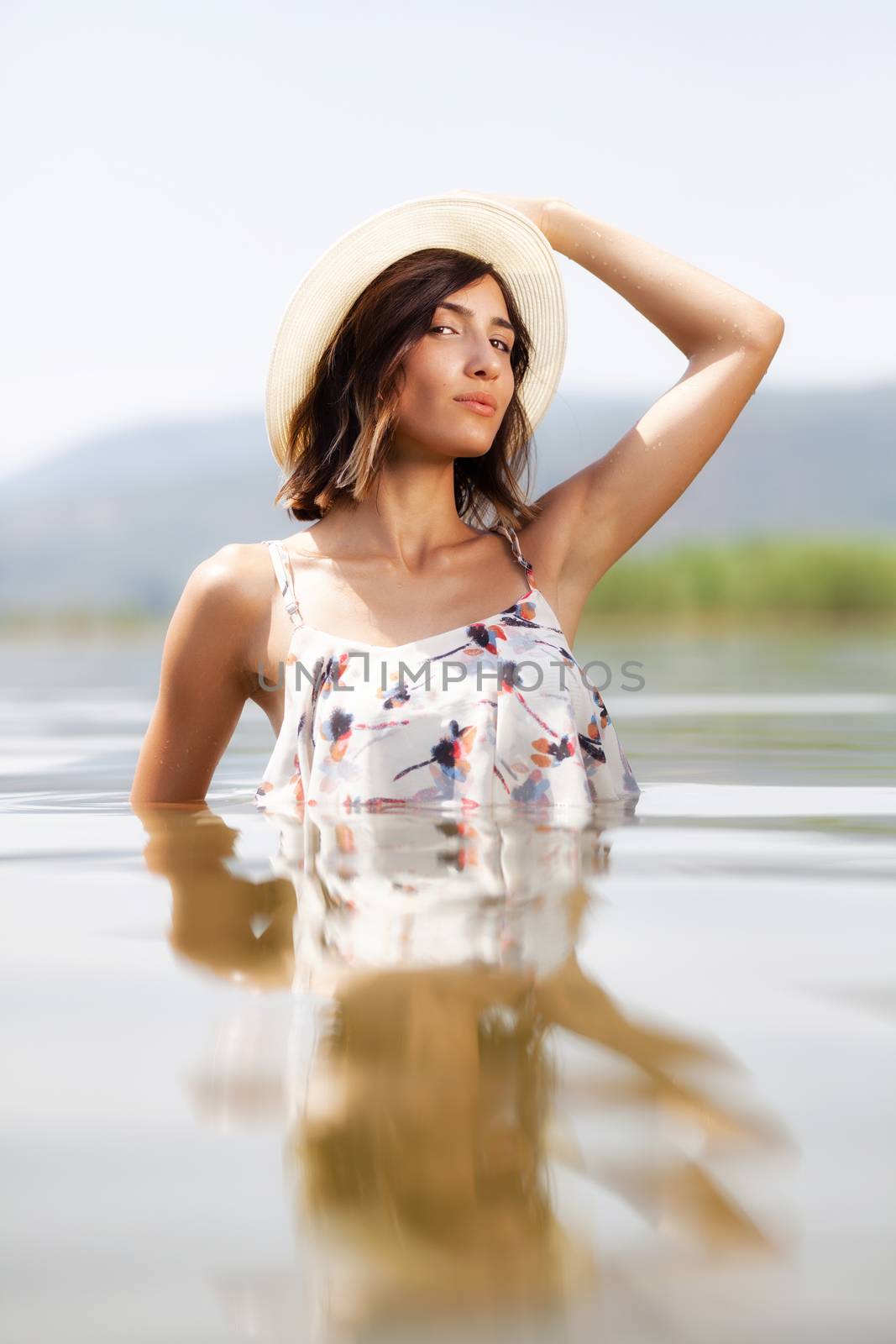 sexy girl with a shirt posing in water