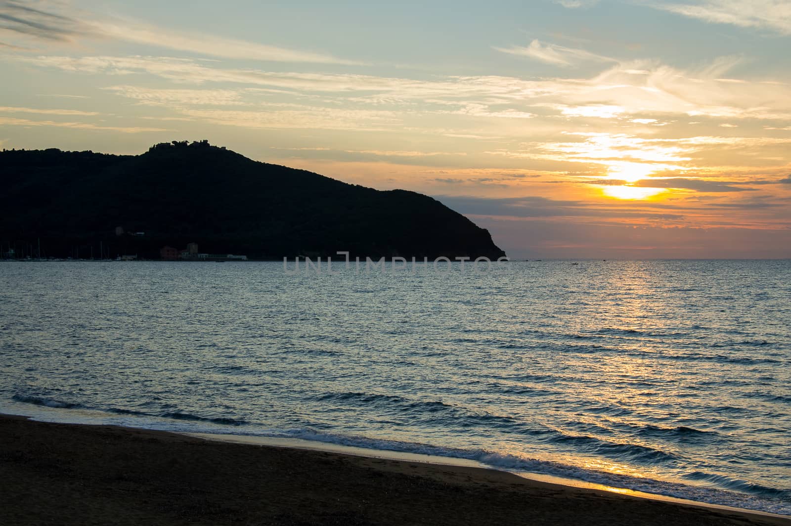 a beautiful view of the baratti gulf at sunset