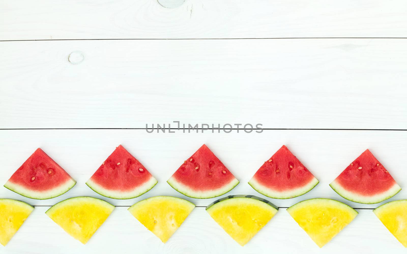 Red and yellow watermelon slices on sticks by ArtSvitlyna