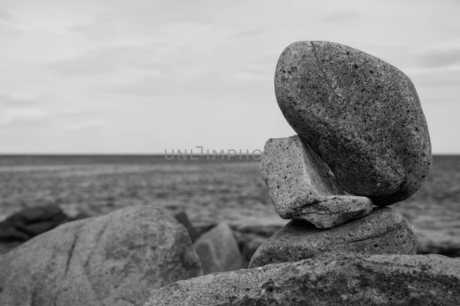 Some rocks standing in balance by the sea