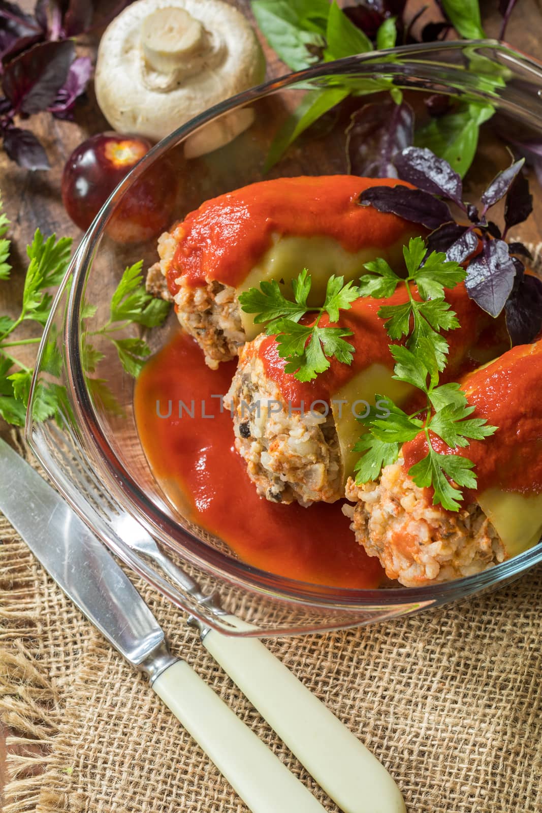 Cooked stuffed pepper served in a transparent glass pot by ArtSvitlyna