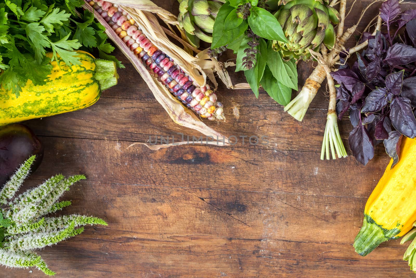 Fresh organic vegetables wooden floor with copy space. Green, yellow and multicolor vegetables background. Healthy eating background. Vegetarian food, organic food.