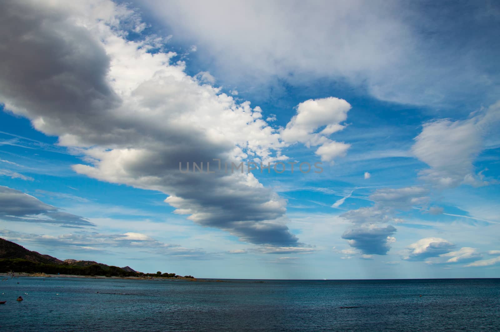 Geometric clouds in Cala Ginepro by Faurinz