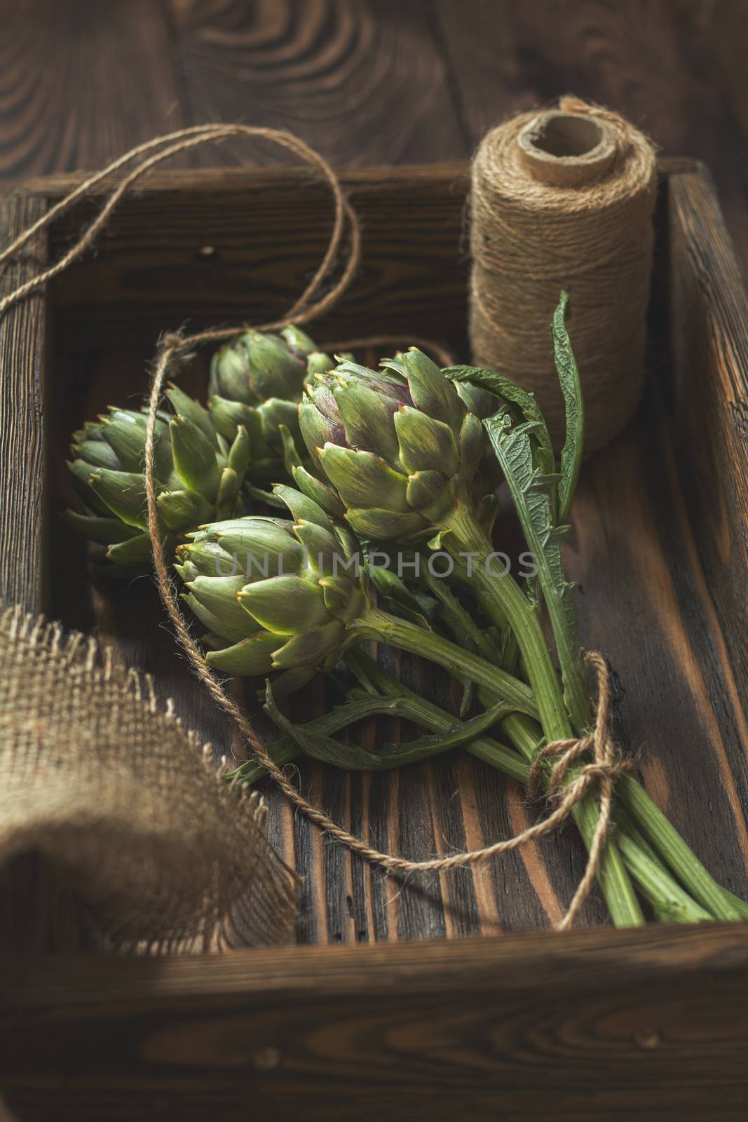 Supplies and materials for artichoke bouquet on wooden backgroun by ArtSvitlyna