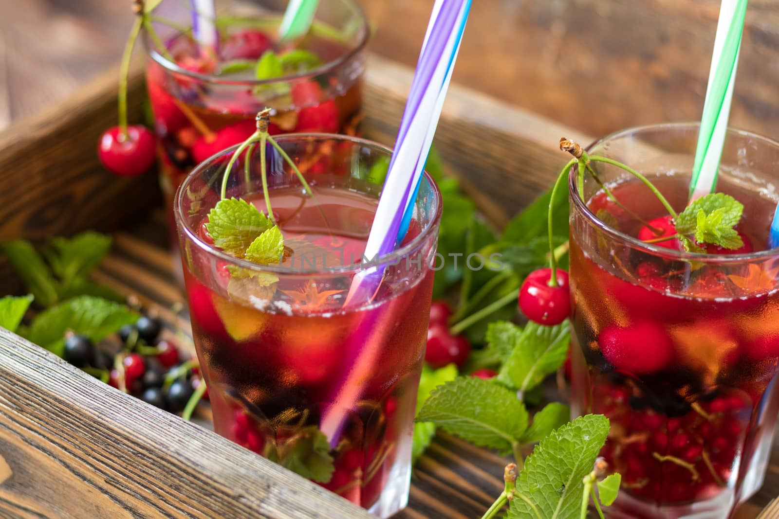Glasses of refreshing  drink flavored with fresh fruit and decor by ArtSvitlyna