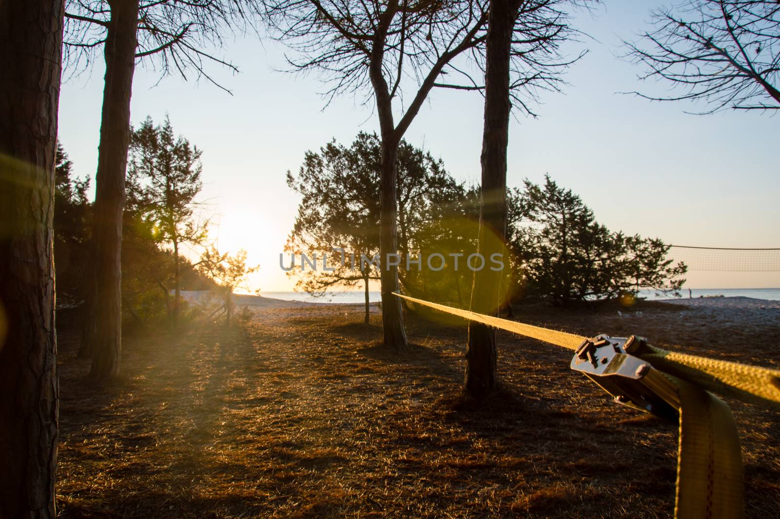 A slackline ready to be used in front of the sea