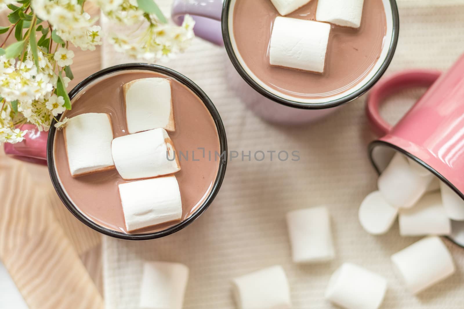 Marshmallows on top of hot cocoa in pink cup by ArtSvitlyna
