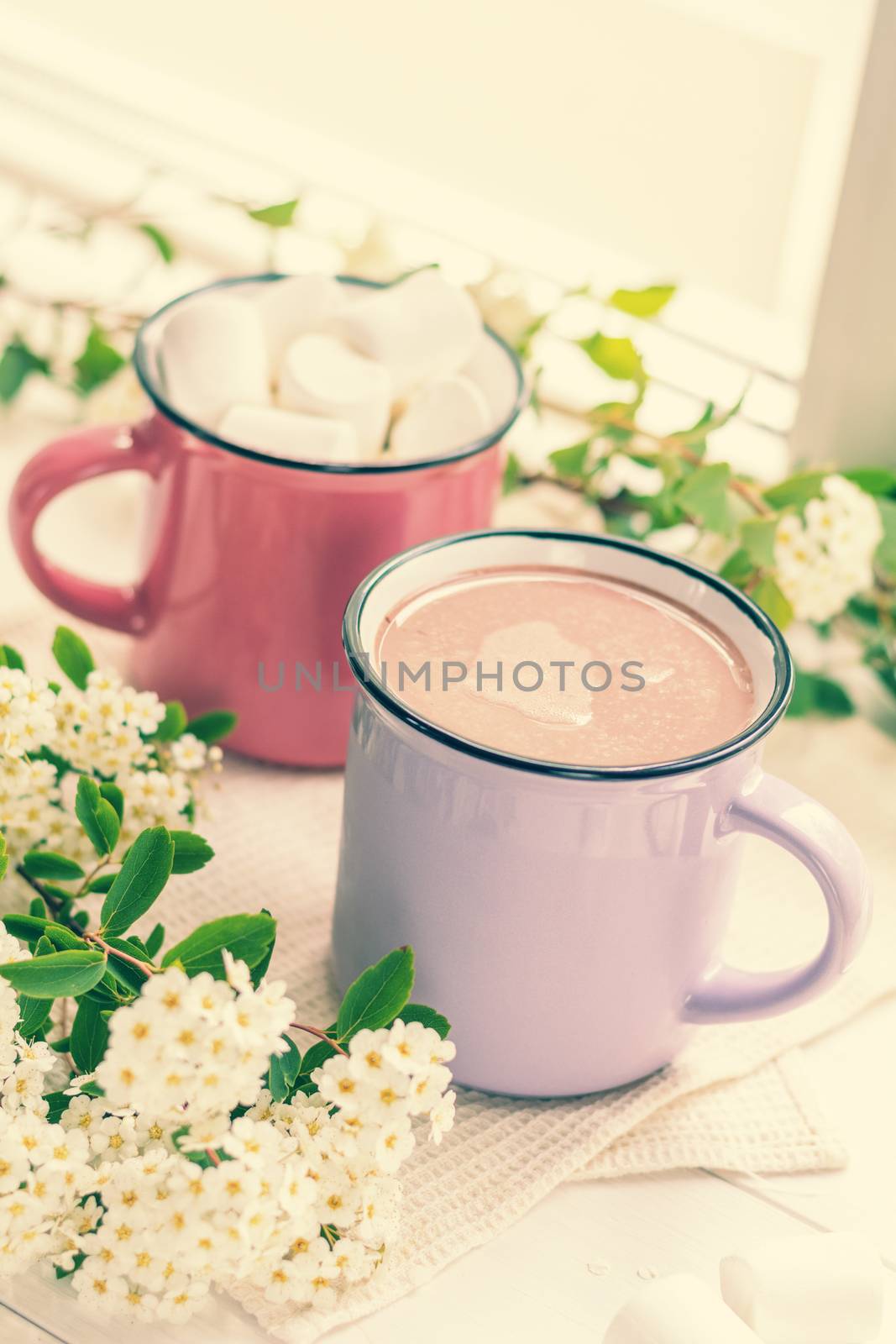 Hot cocoa with marshmallows in pink cups by ArtSvitlyna