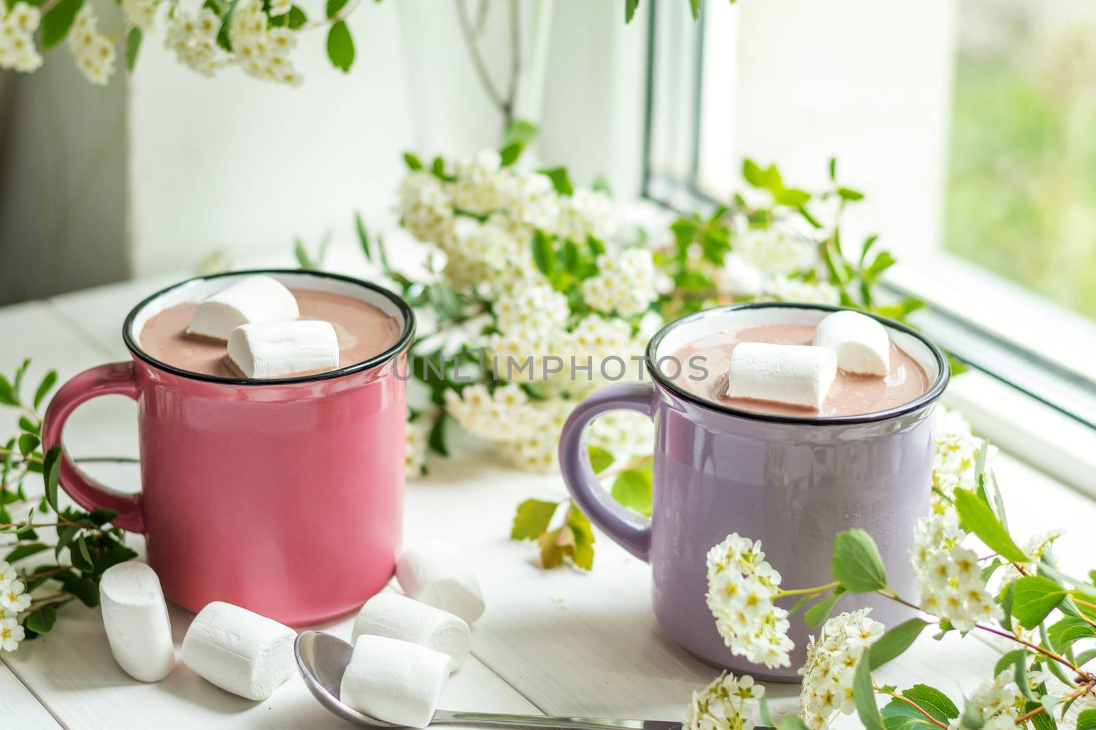 Hot cocoa with marshmallows in pink cups by ArtSvitlyna