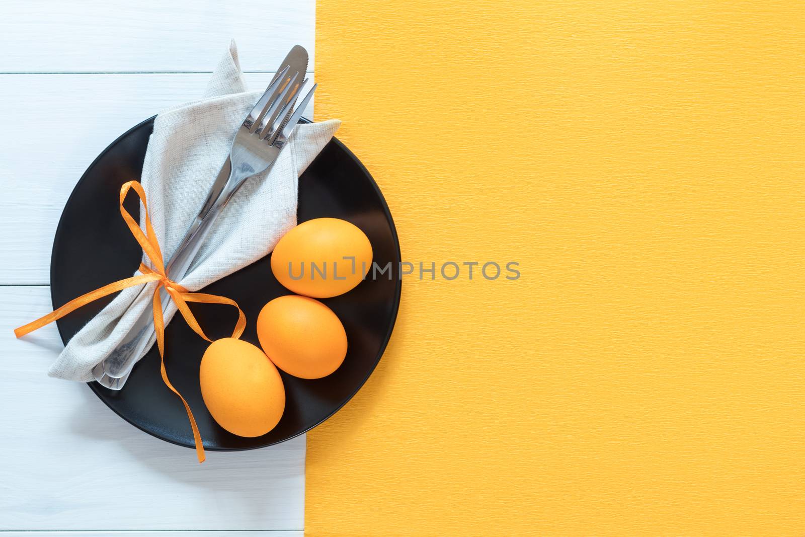 Easter table setting with eggs and cutlery by ArtSvitlyna