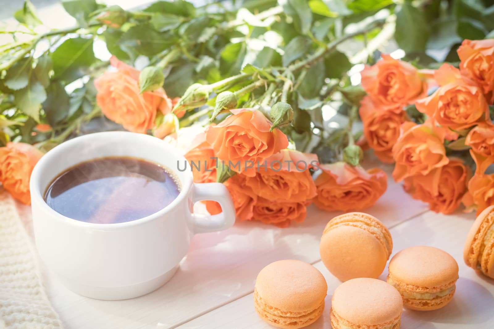 Orange macaroons, cup of coffee and fresh roses by ArtSvitlyna