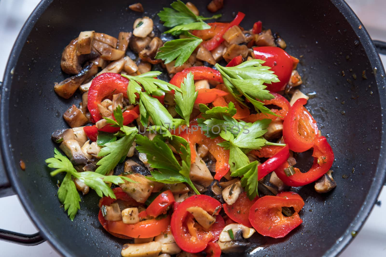 Mushrooms and fresh sweet red pepper in the pan by ArtSvitlyna