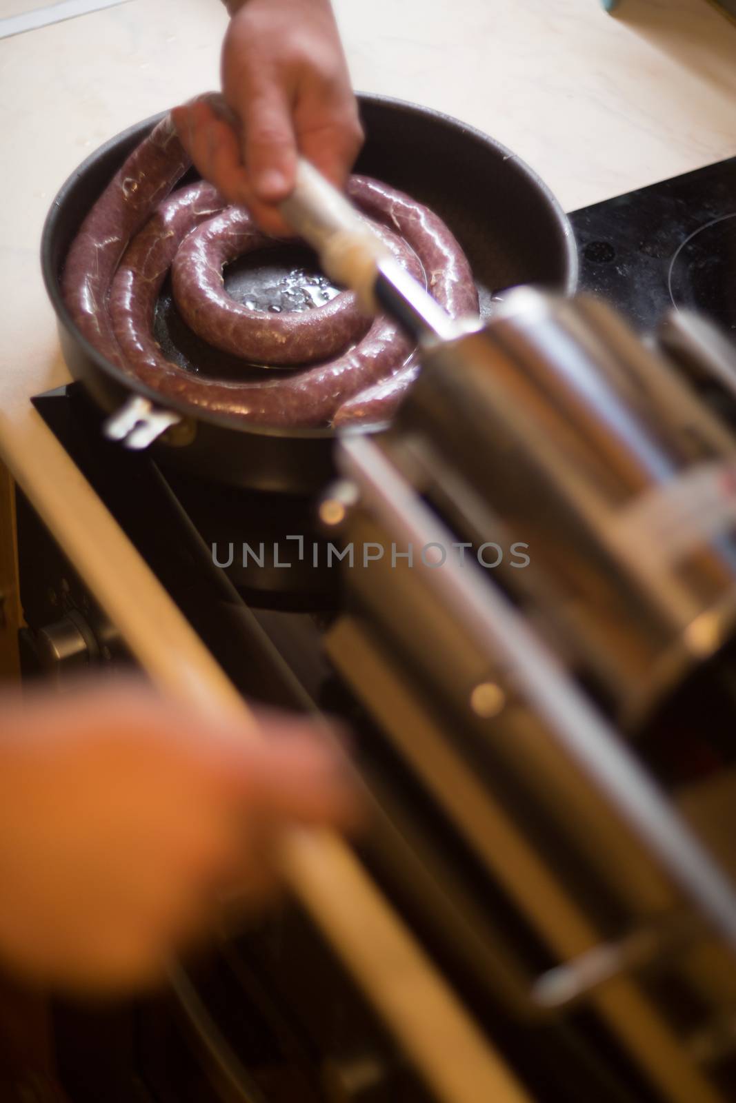 Close up of process of making homemade sausage at home with pressure machine