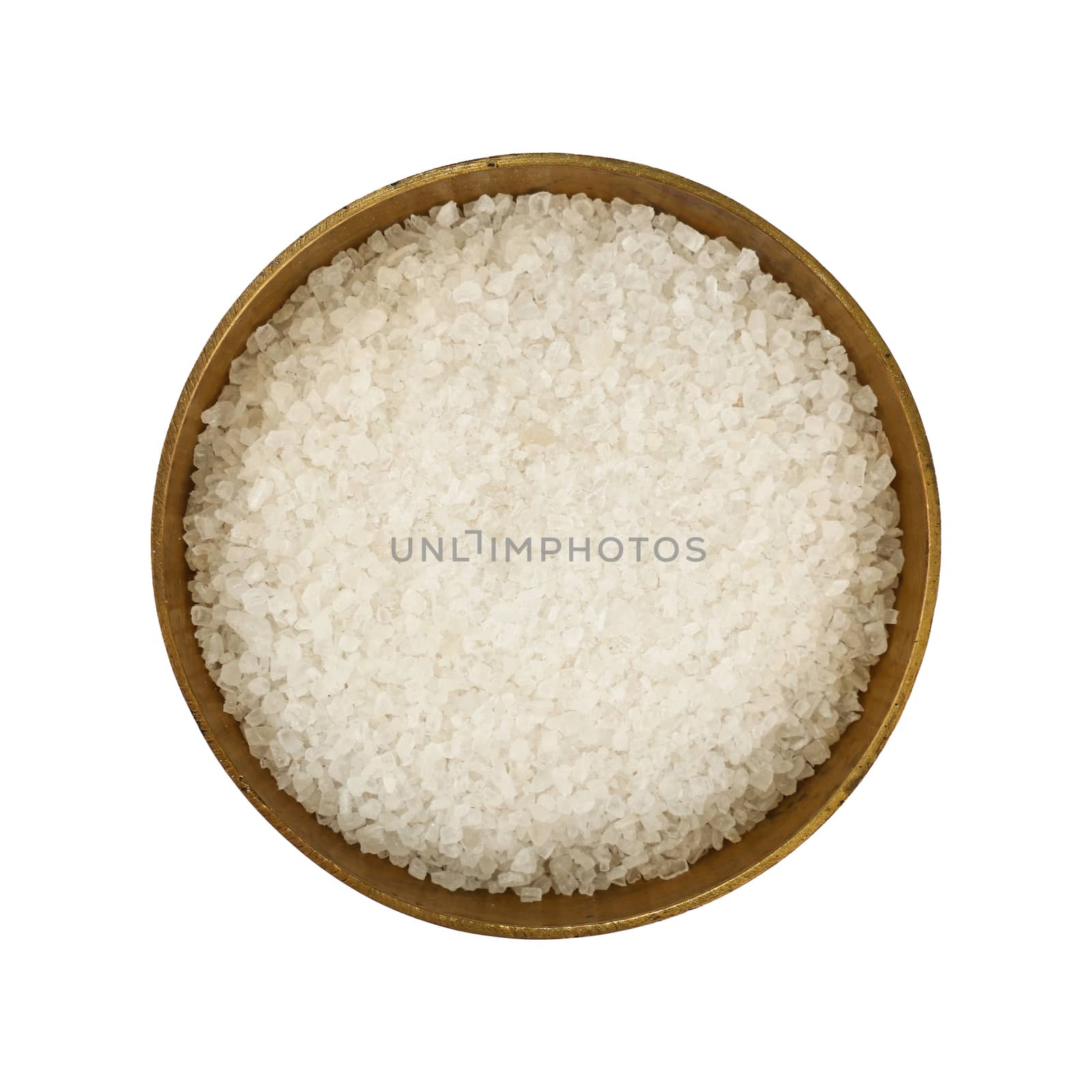 Close up one vintage bronze metal bowl full of white marine rock salt, isolated on white background, elevated top view, directly above