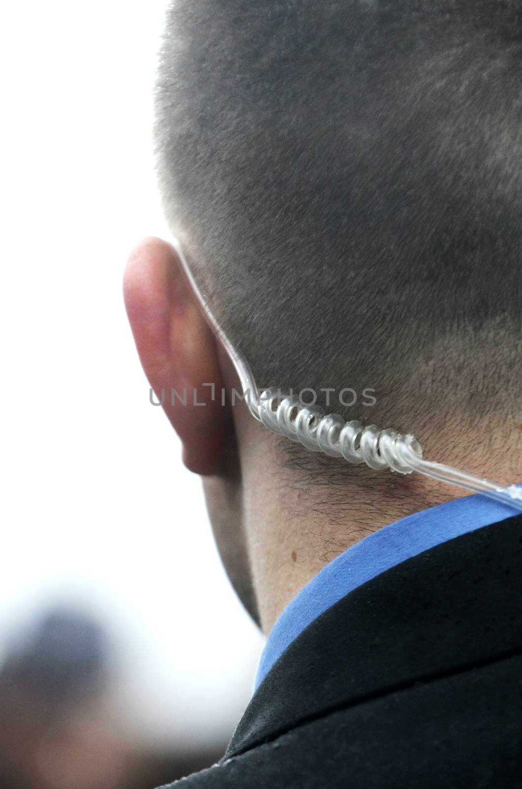 Secret service agent with headphones listening commands