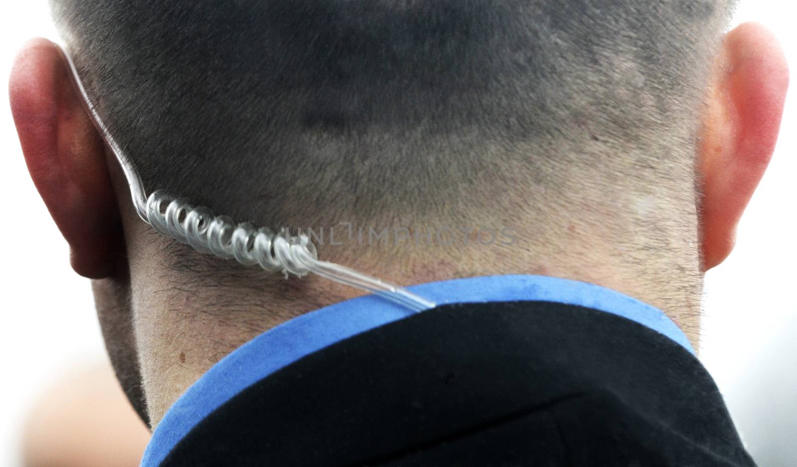Secret service agent with headphones listening commands