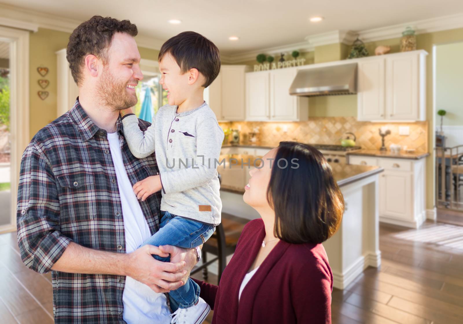 Young Mixed Race Caucasian and Chinese Family Inside Custom Kitchen. by Feverpitched