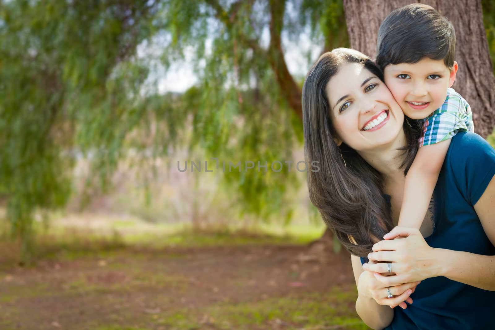 Young Mother and Son Portrait Outdoors.