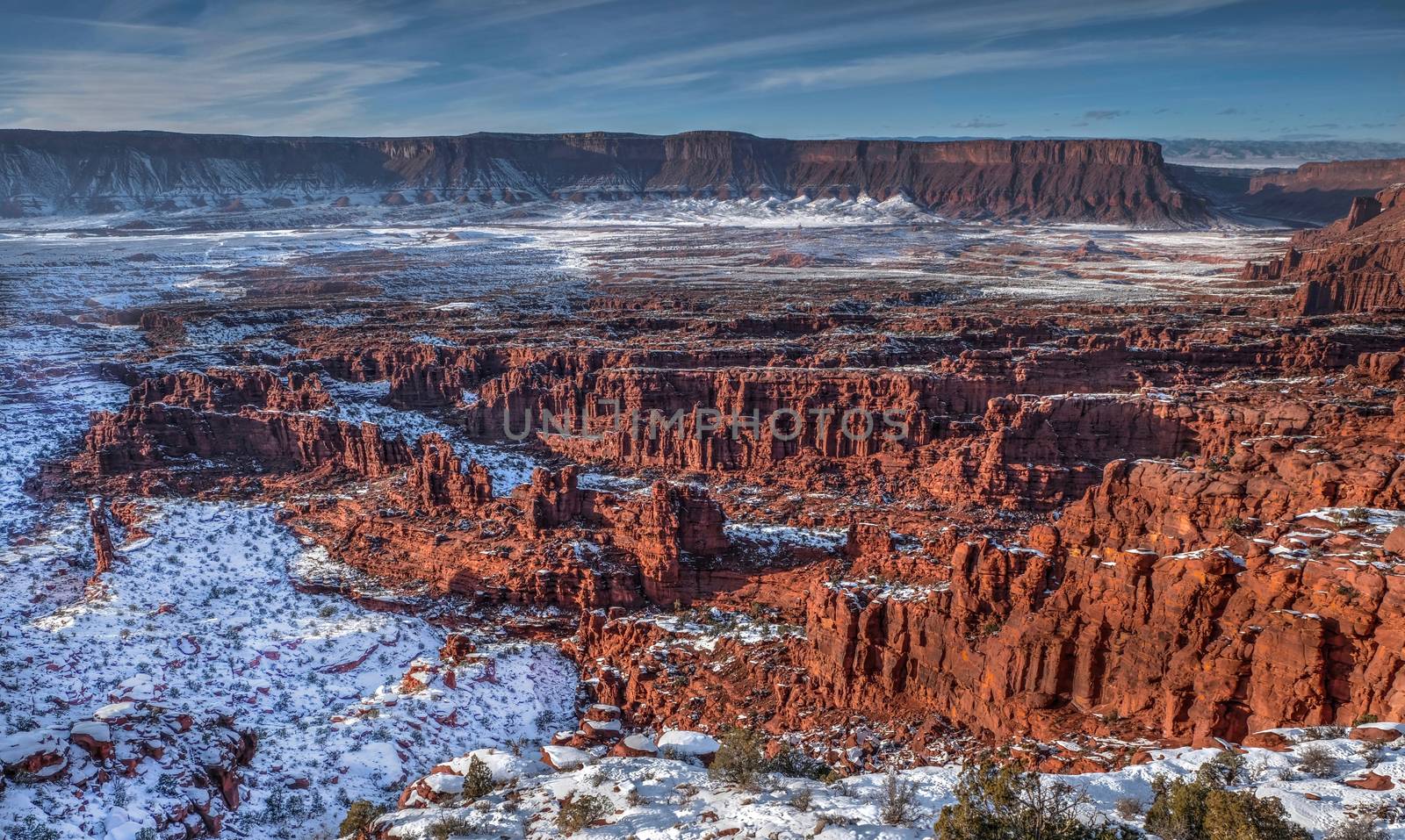 Sandstone formations under snow in Professor Valley near Moab. Fisher towers. by marina_poushkina