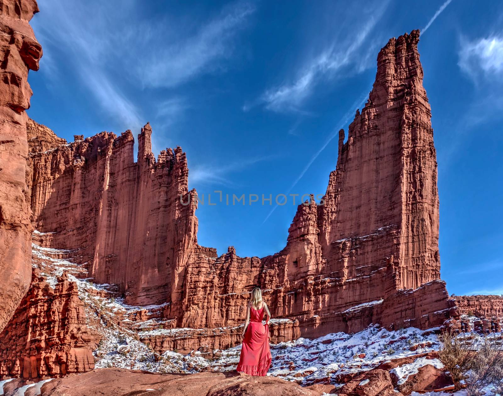 Woman enjoying scenic view of sandstone formations. by marina_poushkina