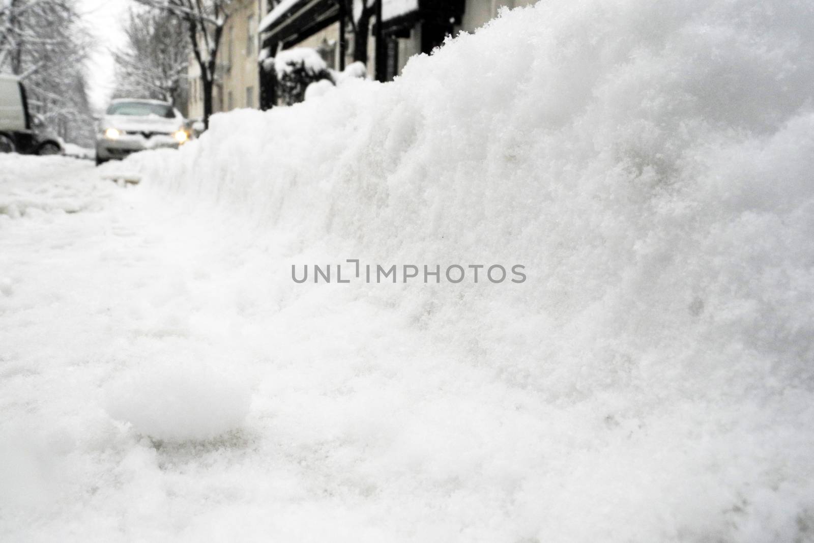 Low angle of view of lot of snow on the street