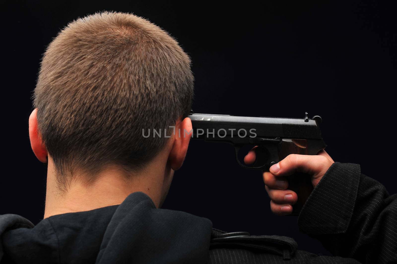 Young man trying to commit suicide with gun