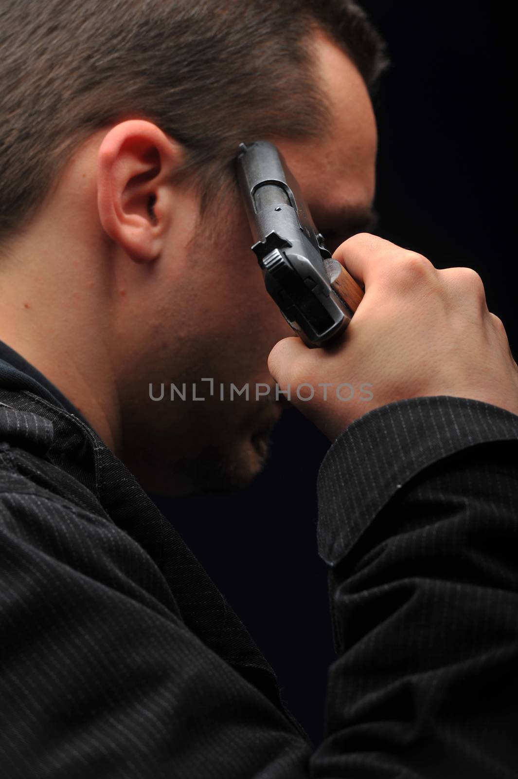 Young man trying to commit suicide with gun