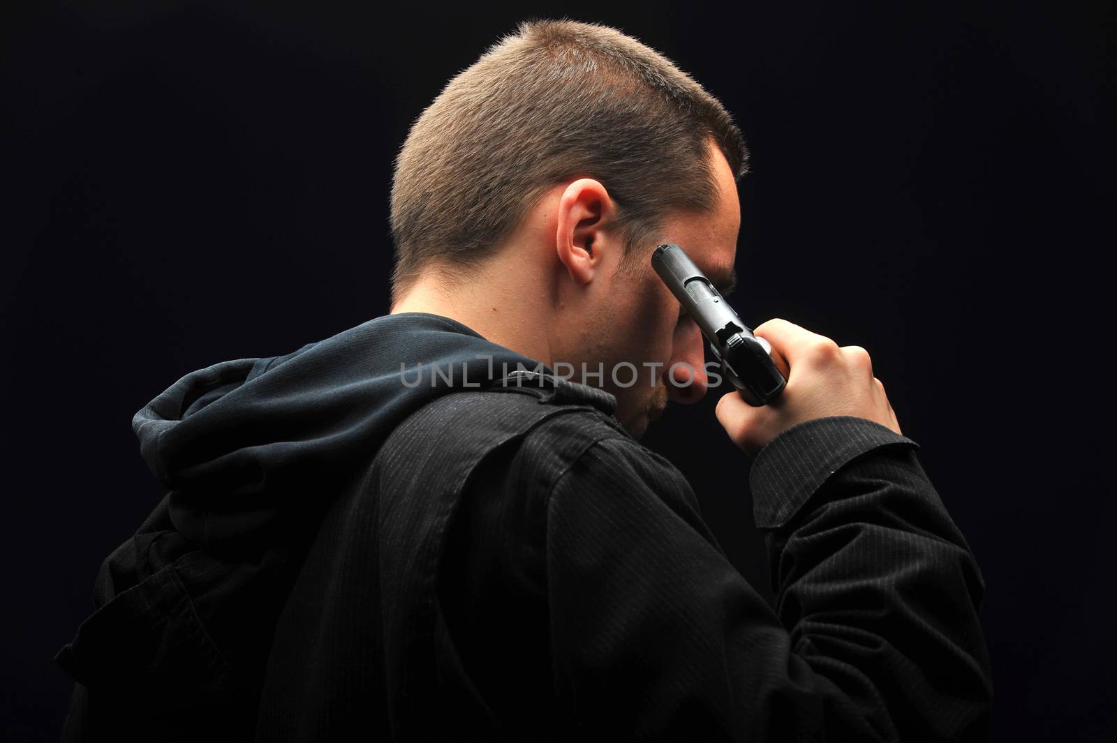 Young man trying to commit suicide with gun