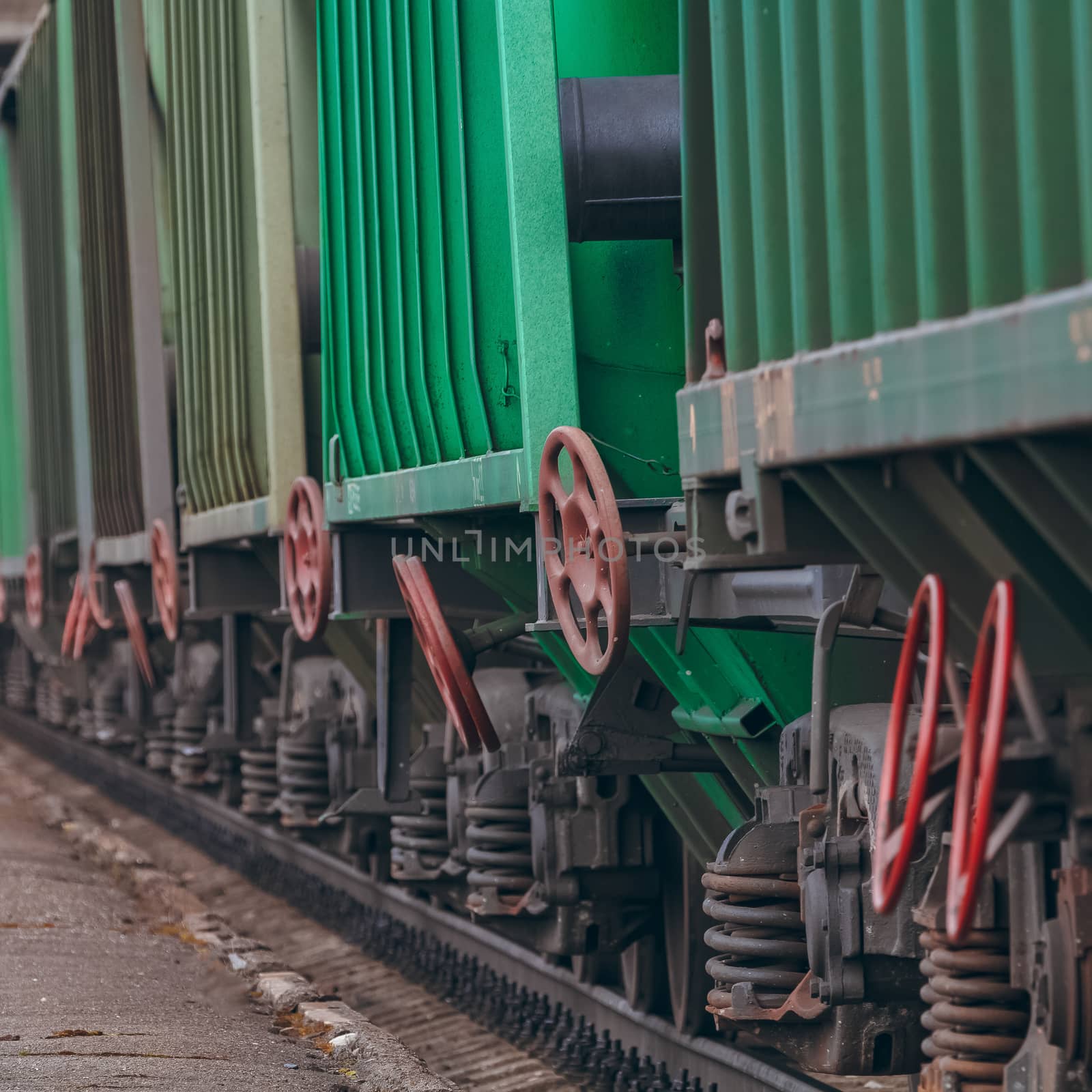 Green cargo wagons. Freight train in action