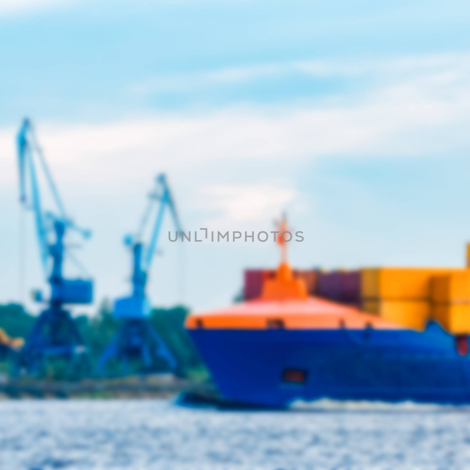 Blue cargo ship - soft lens bokeh image. Defocused background