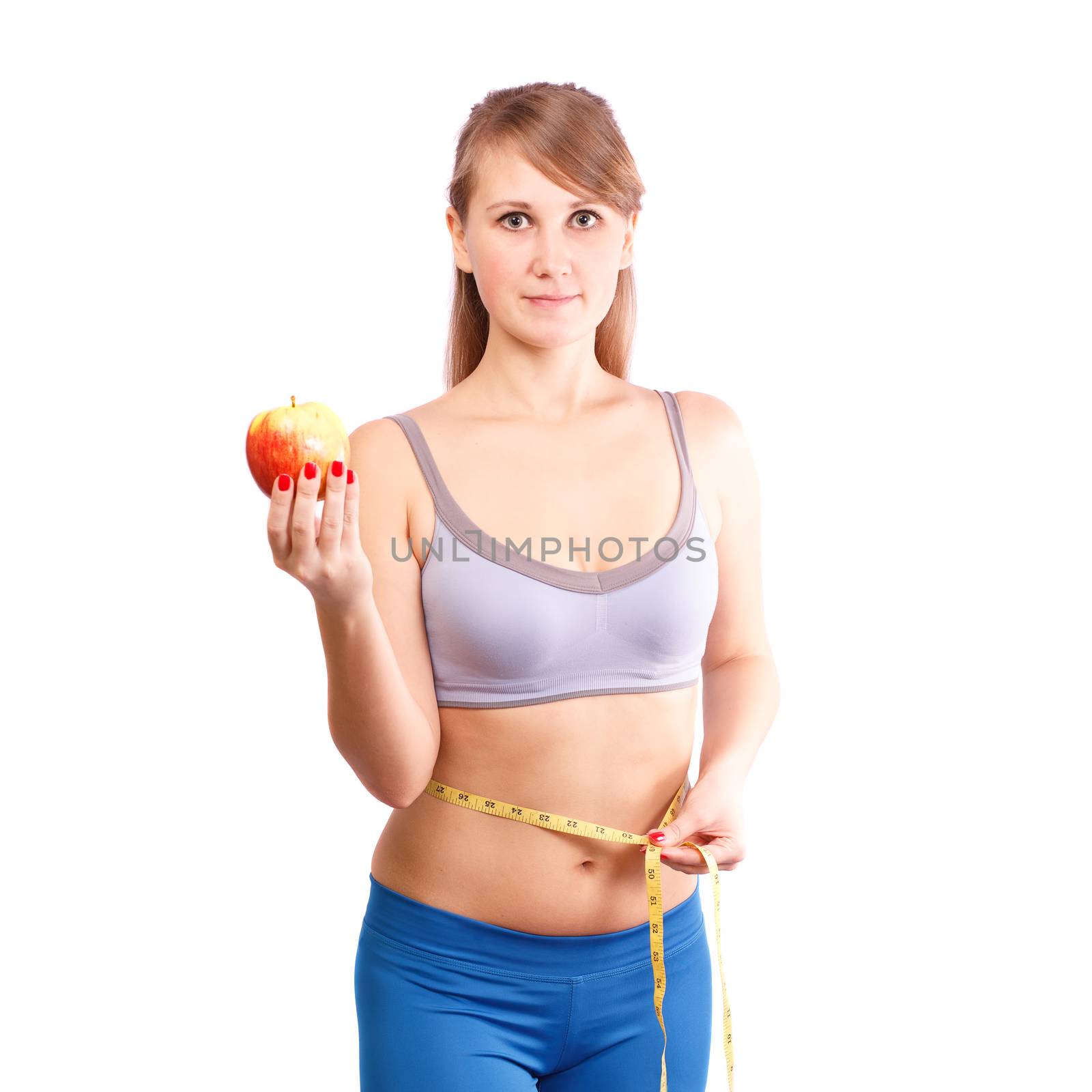 
Girl after exercise meter measures your waist on a white background.