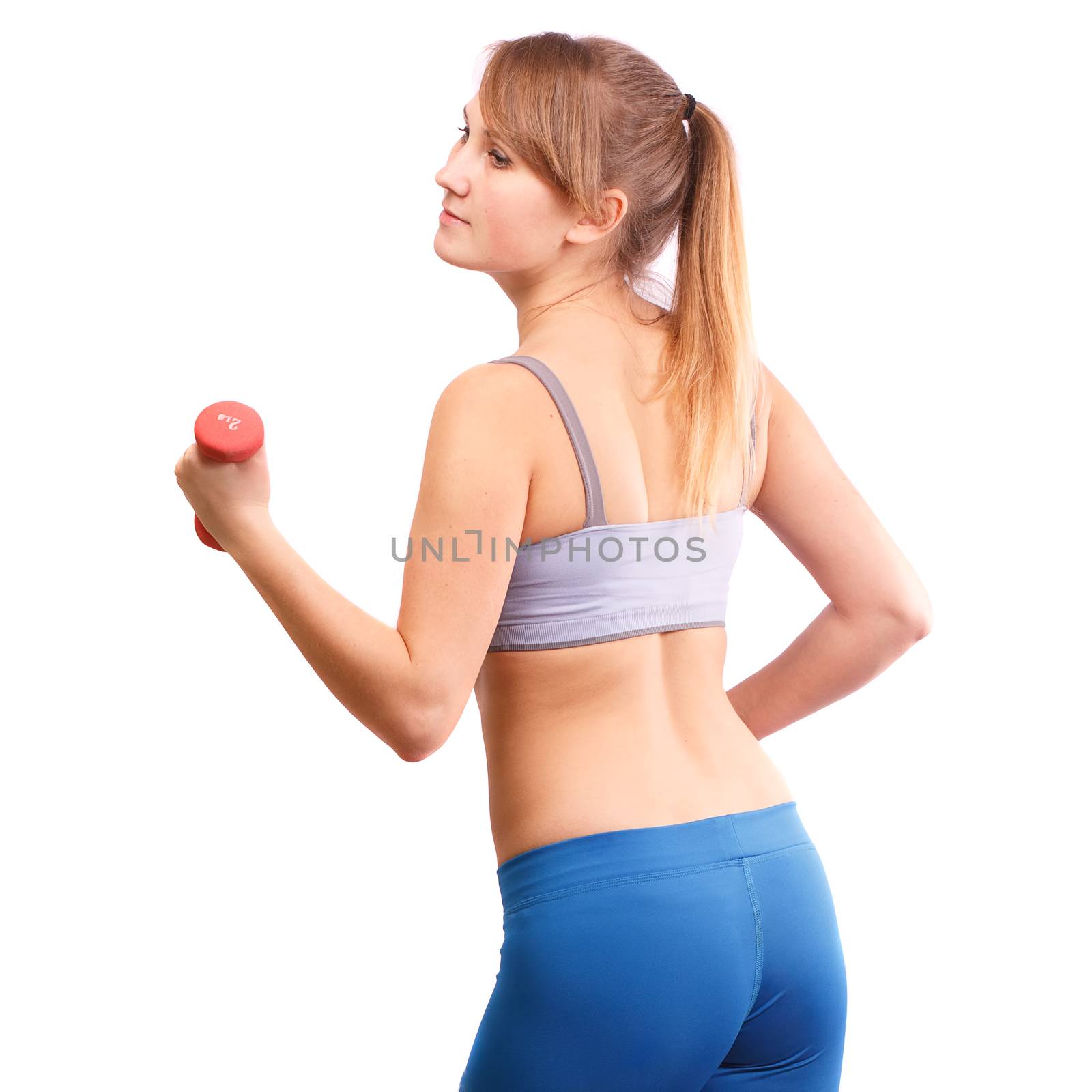 The girl goes in for sports with dumbbells on a white background.