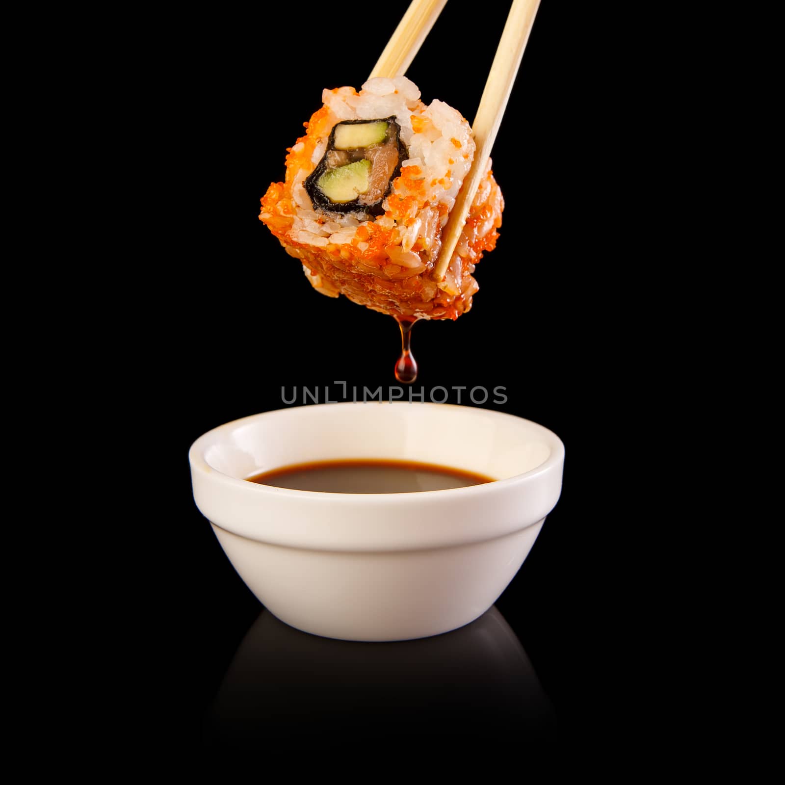 Roll the delicious sushi on a black background.