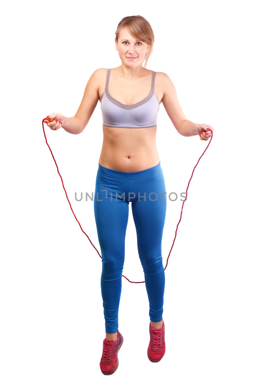 Girl jumping rope on a white background.