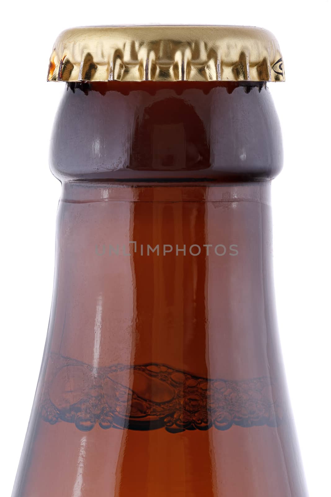Closed, brown beer bottle on a white background.