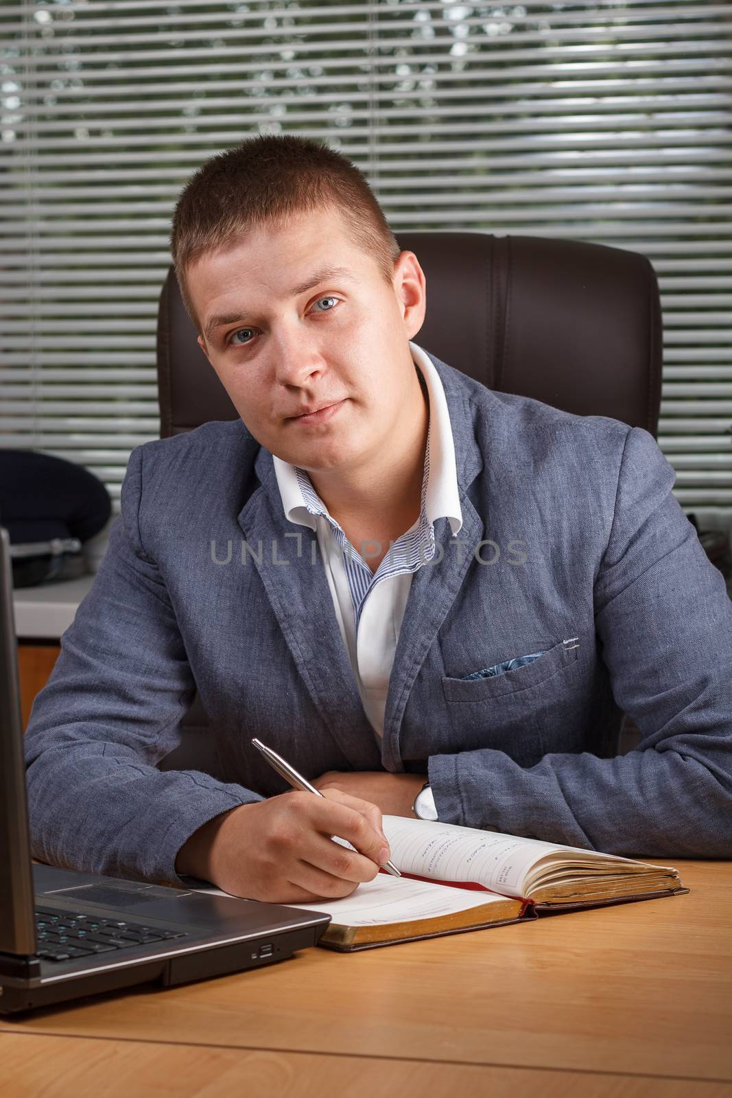 The guy in the office at the table.