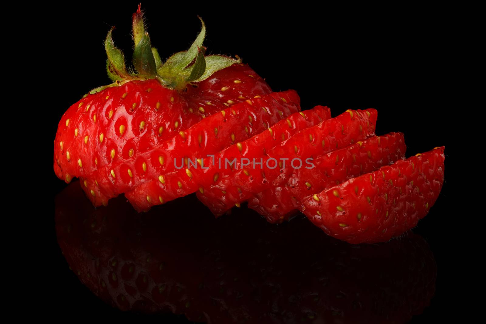 Natural fresh strawberries on a black background.
