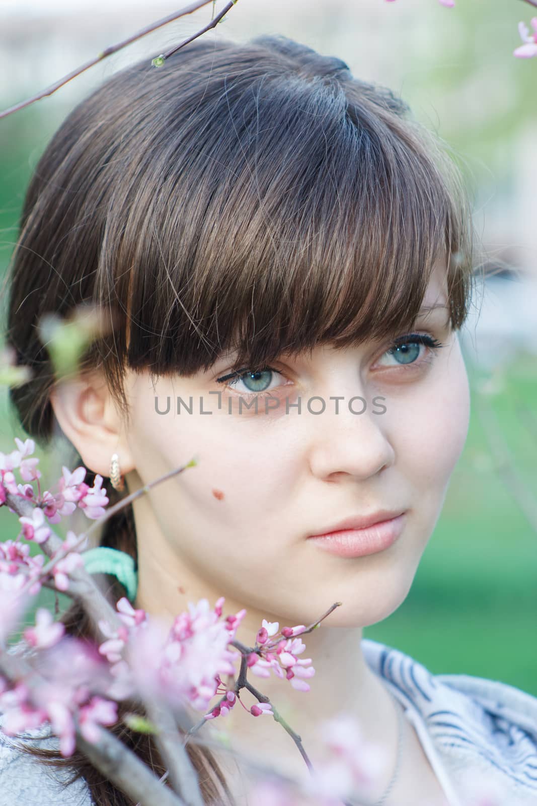 Portrait of pretty young girl outdoors.