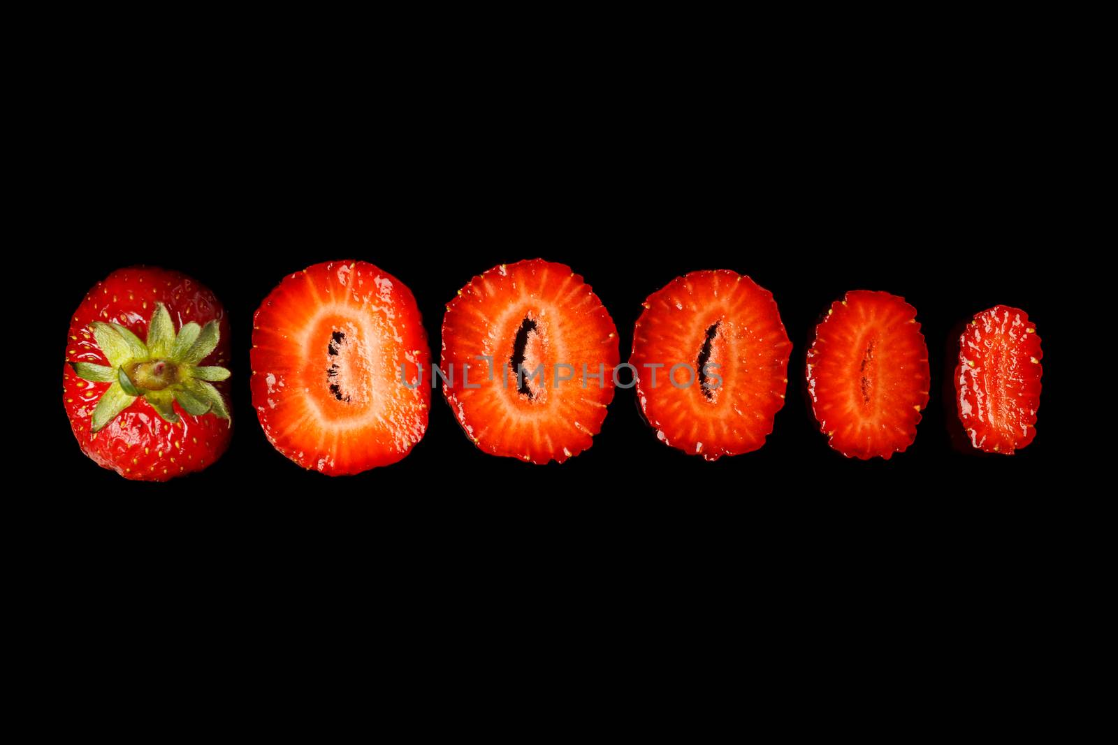 Natural fresh strawberries on a black background.
