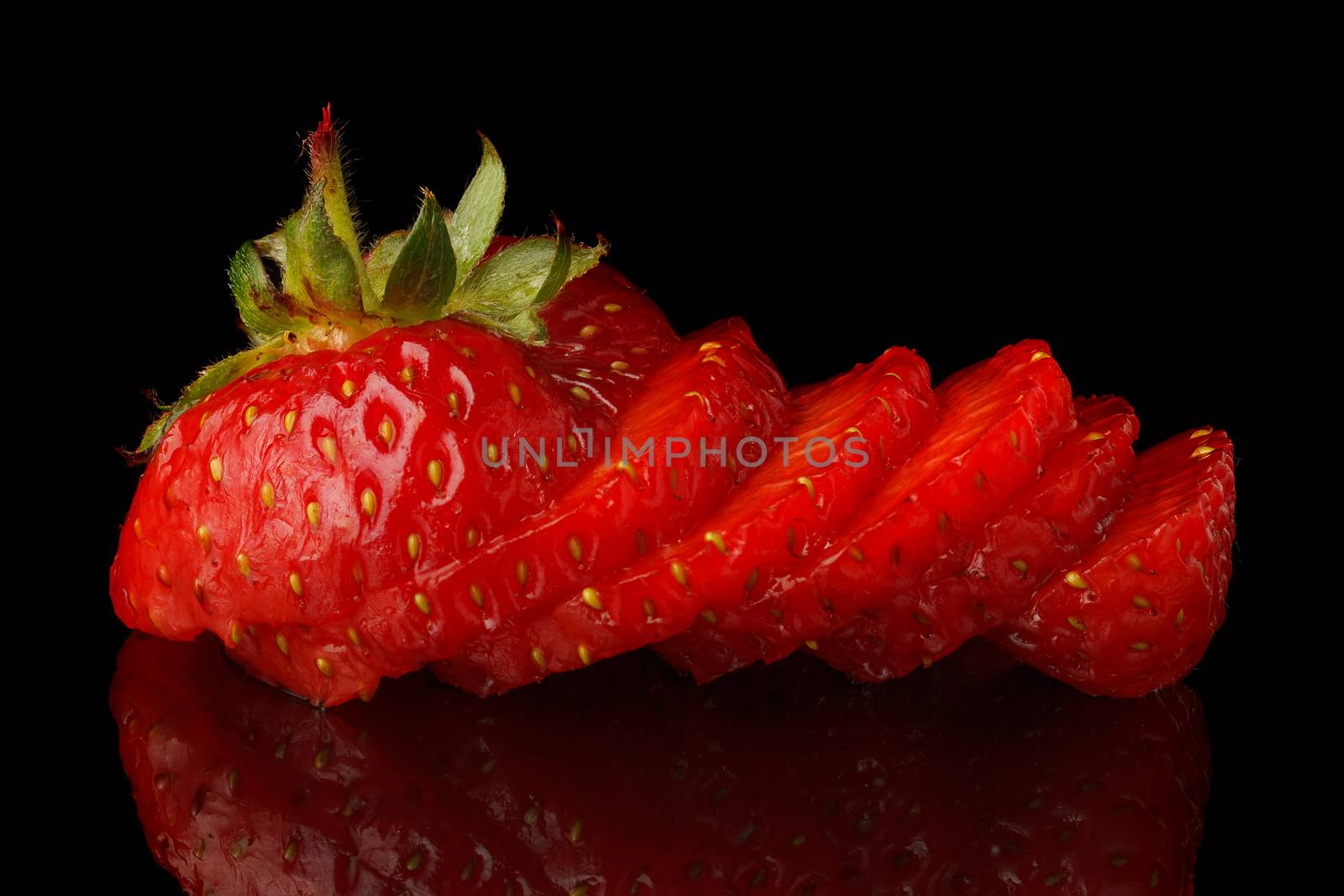 Natural fresh strawberries on a black background.
