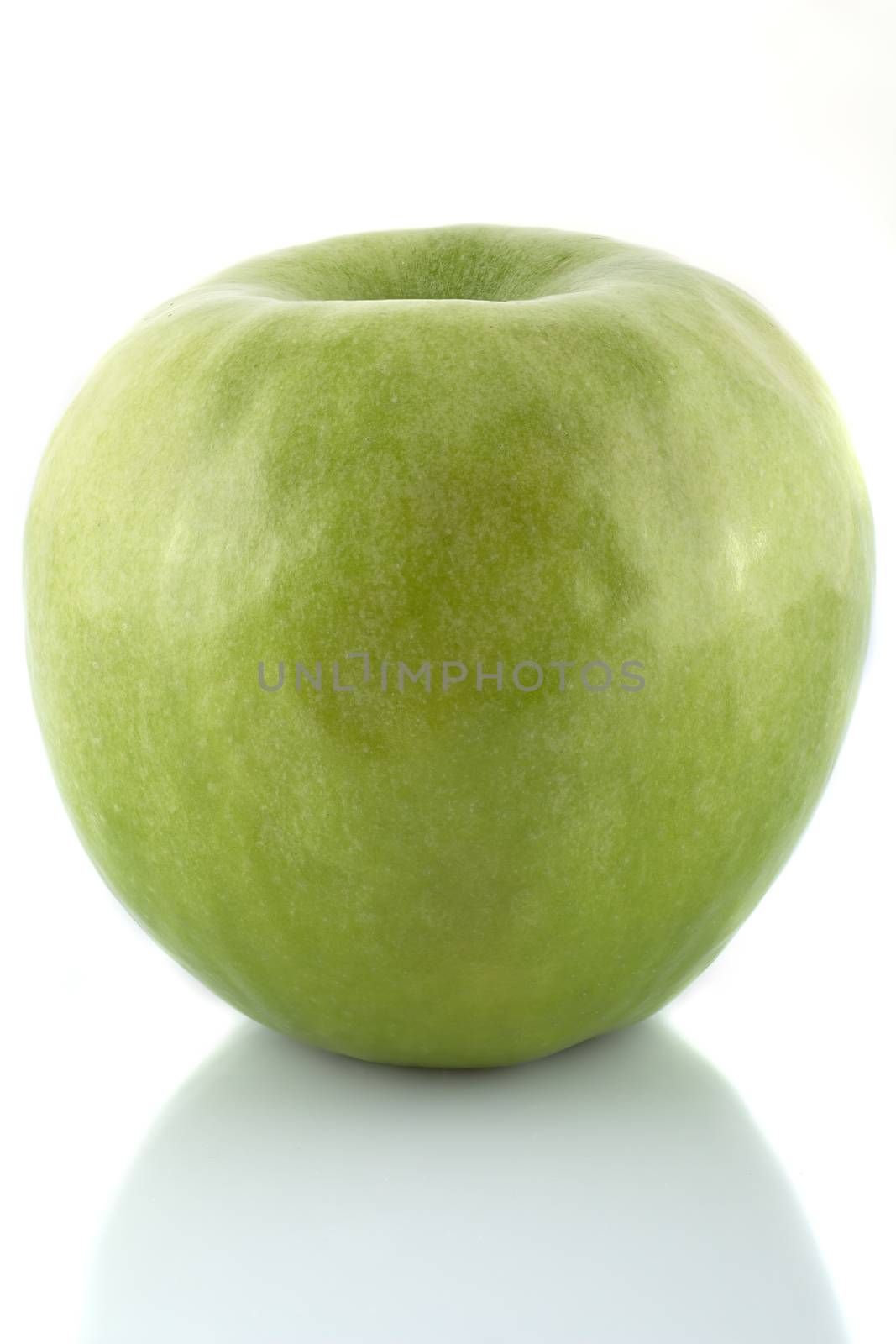 Juicy green apple isolated on a white background.
