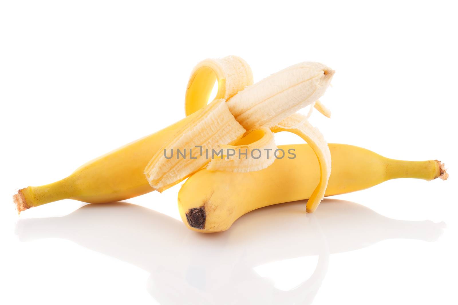 Half peeled ripe banana and another not peeled on a white background.